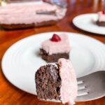 The finished Easy Raspberry Chiffon Brownie Cake with a fork displaying a piece of it