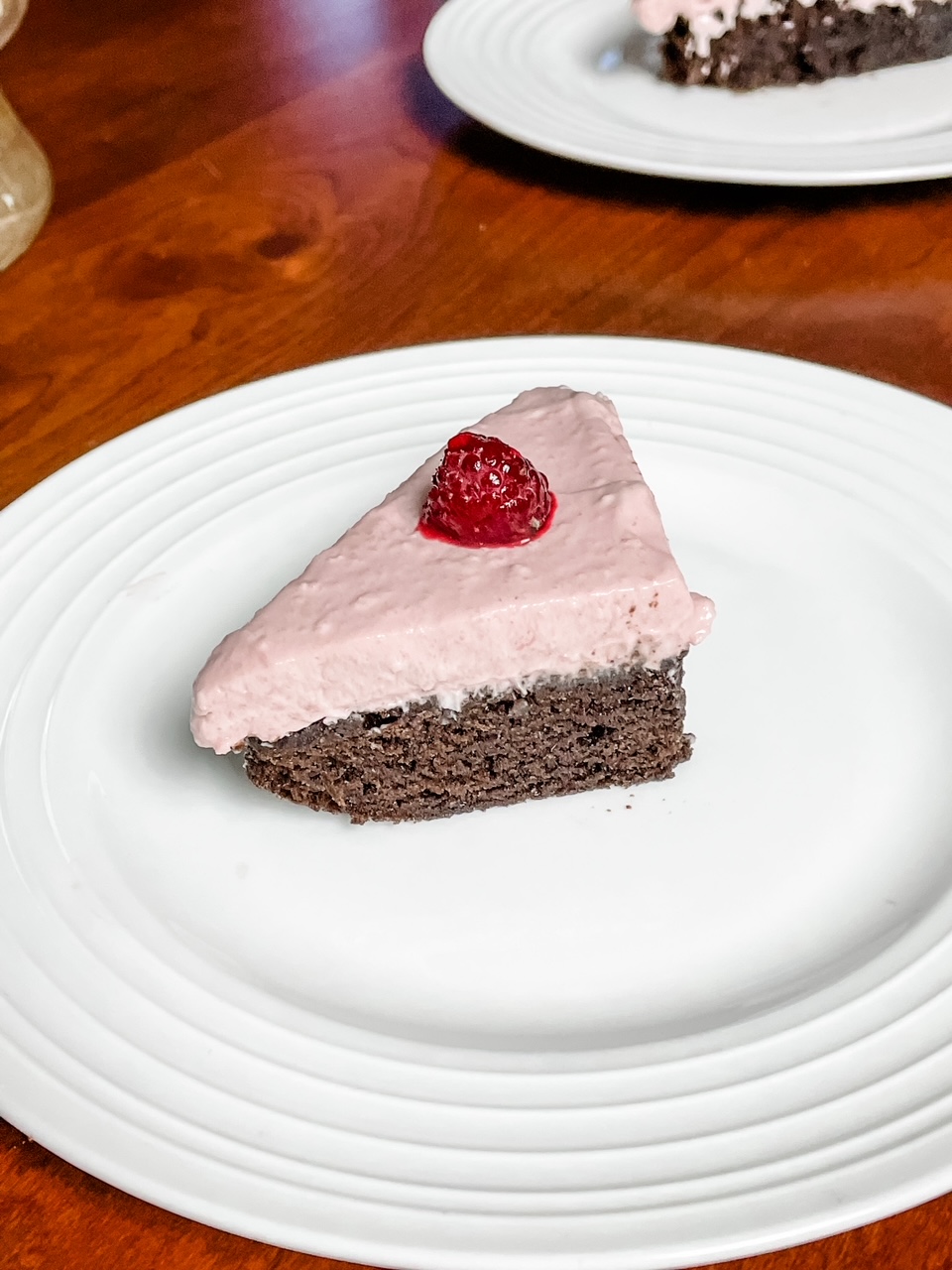 The plated Easy Raspberry Chiffon Brownie Cake cut into triangles