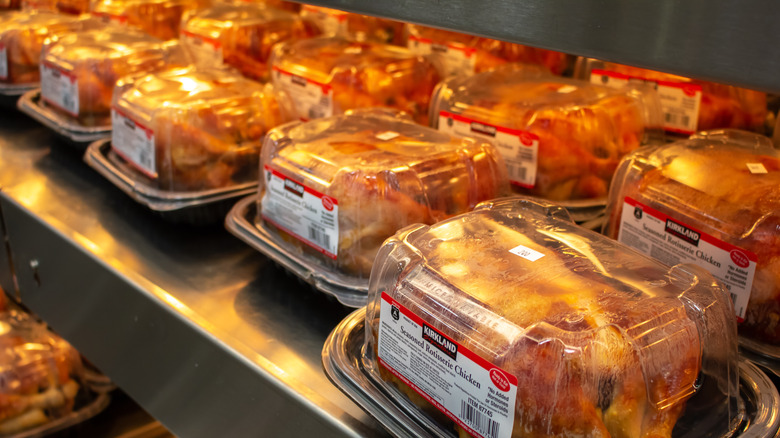 A row of packaged rotisserie chickens