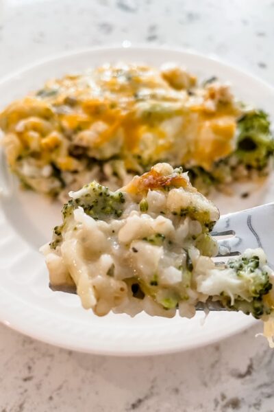 A fork lifting a bite of the Healthier Broccoli Rice Casserole with Chicken up
