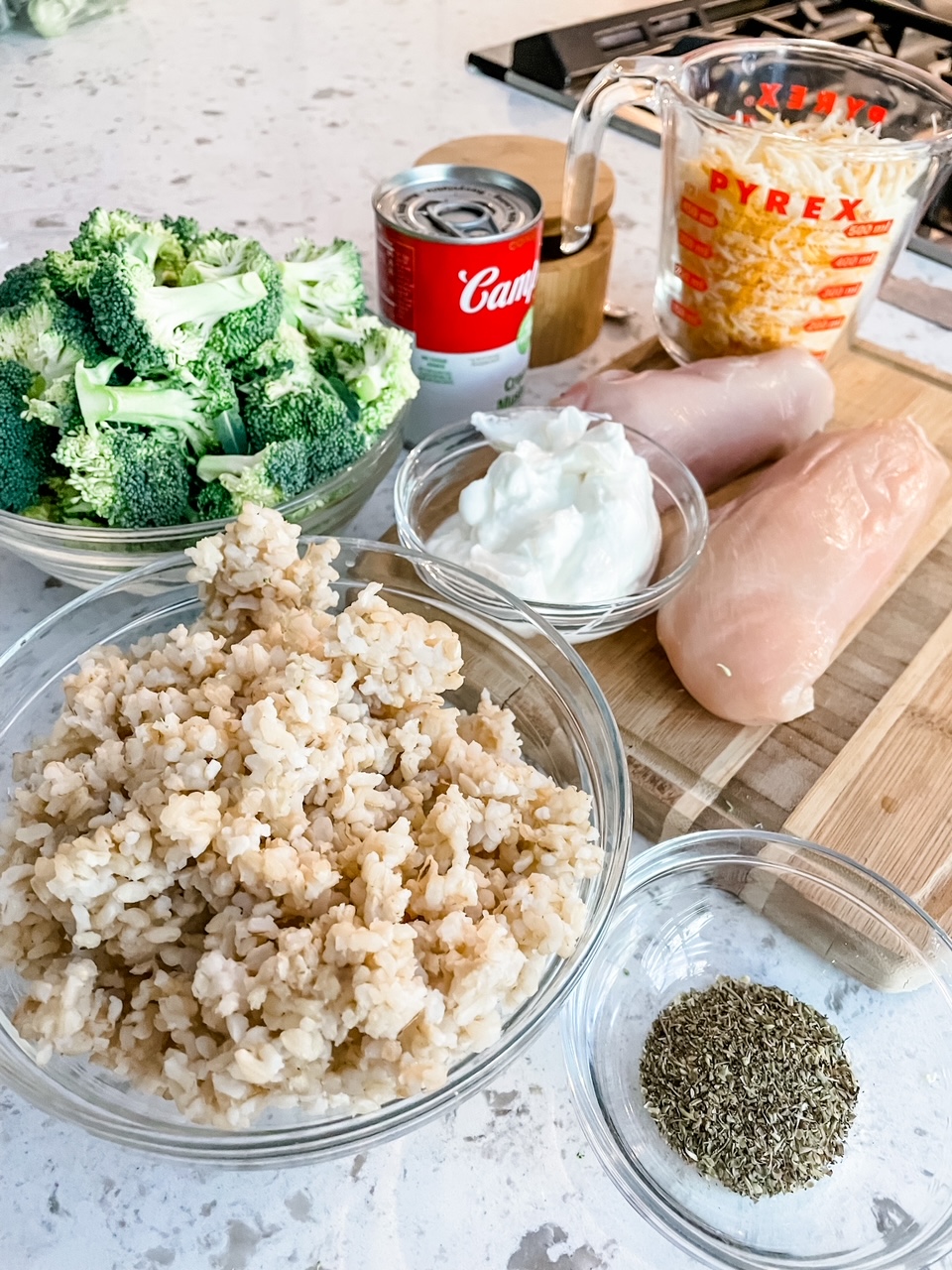 The ingredients - broccoli, chicken, rice, spices, and soup