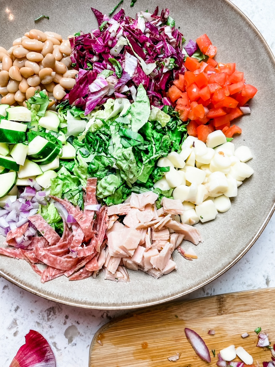 The Mediterranean Chopped Salad Recipe ingredients, chopped in a bowl but not yet mixed together