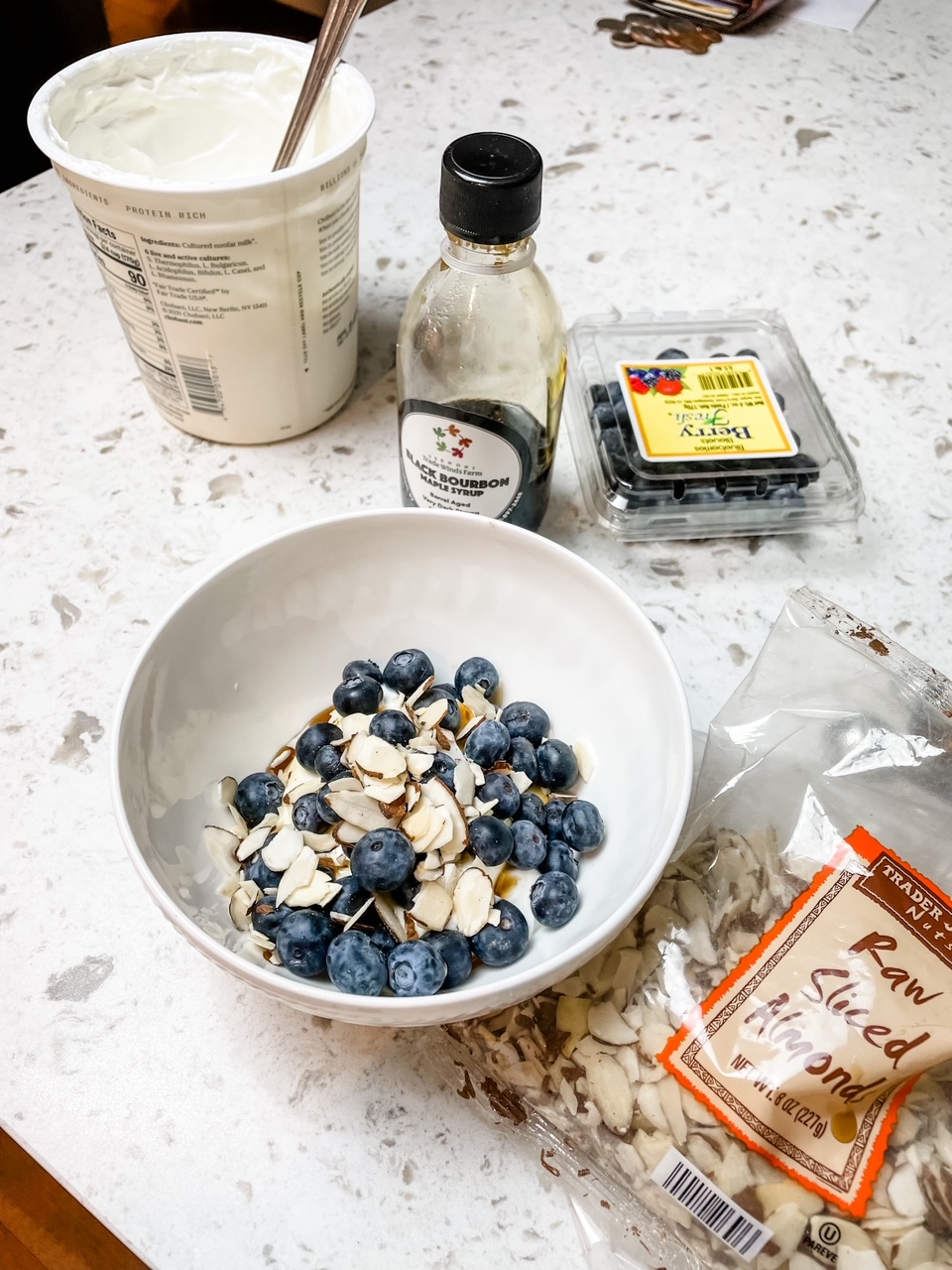 Quick and Healthy Breakfasts: The yogurt parfait assembled, surrounded by its ingredients