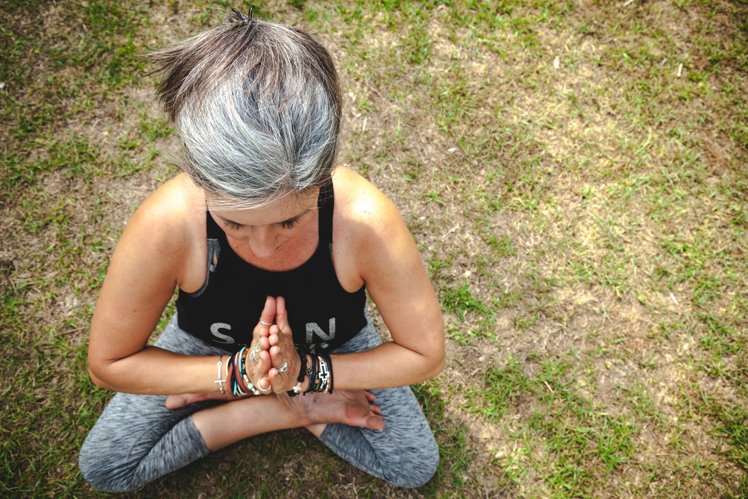 A woman in a yoga pose - a form of Self-Care for Caregivers