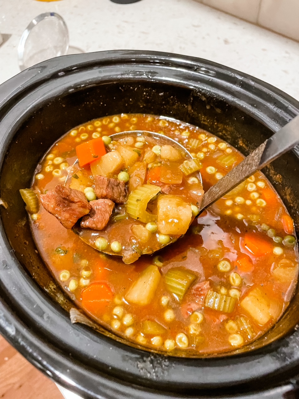 A corckpot with the Best Irish Beef Stew with Guinness simmering
