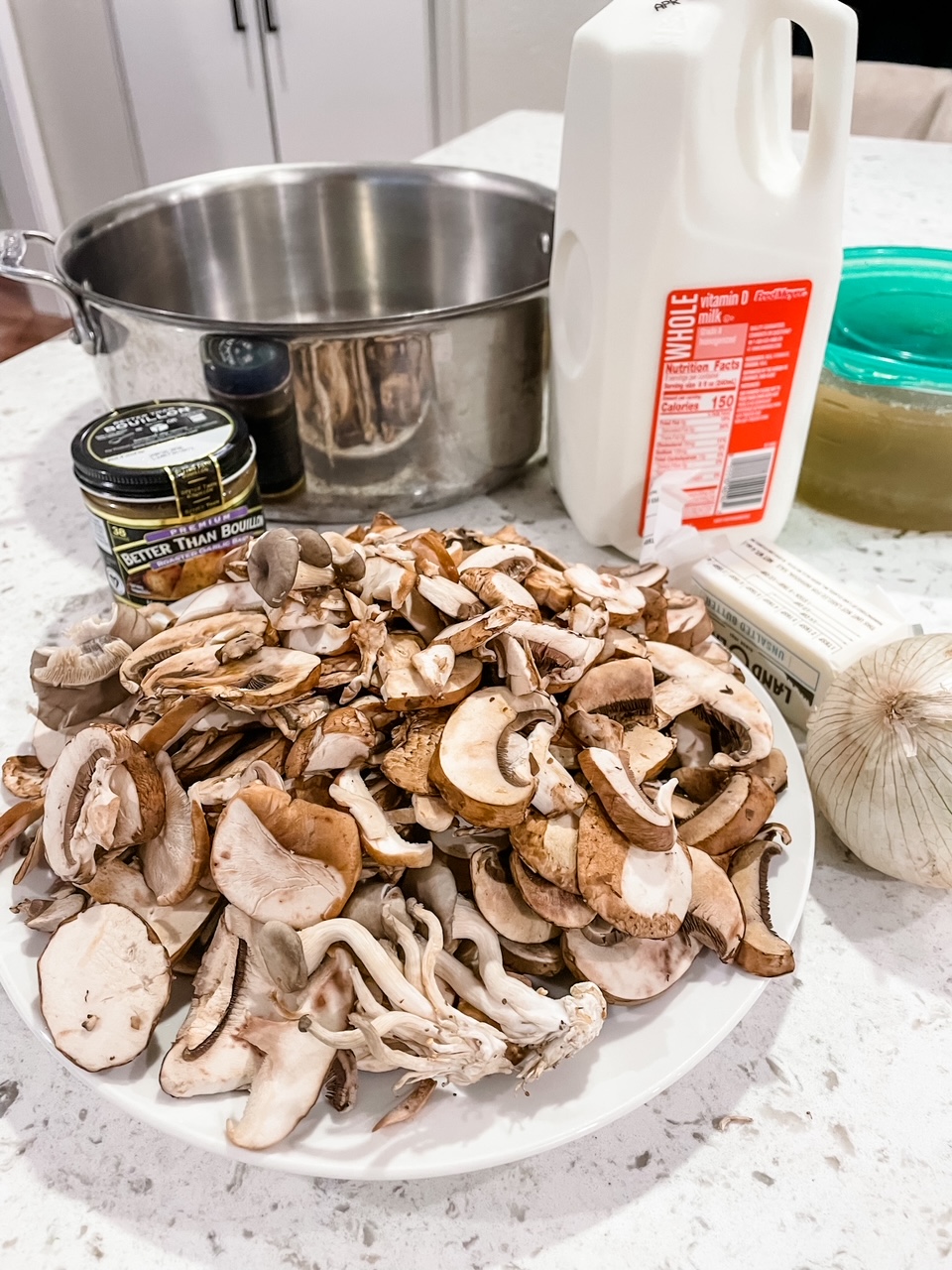 The ingredients for the Creamy Garlic Mushroom Soup - mushrooms, whole milk, herbs, bouillon, and herbs 