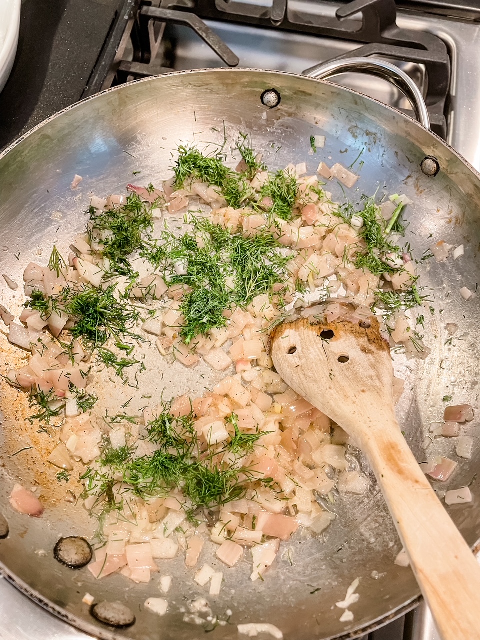 The shallots, butter, lemon, and dill being sauteed