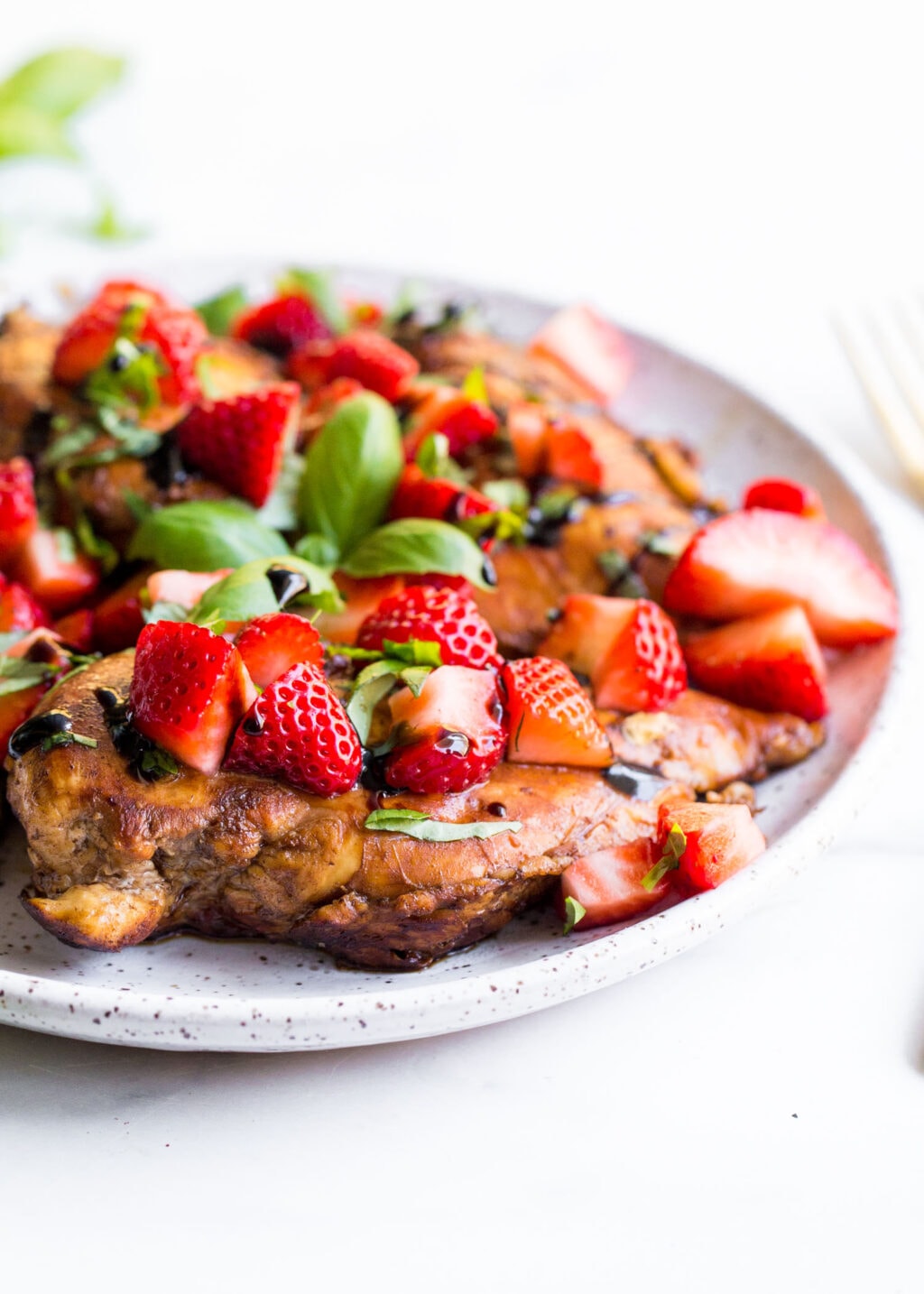 A plate with a heaping helping of the strawberry basil chicken