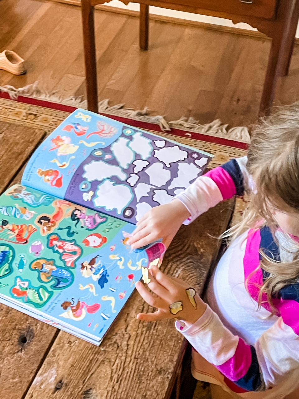 Unplugged Activities for Kids: Marie's granddaughter playing with a sticker book
