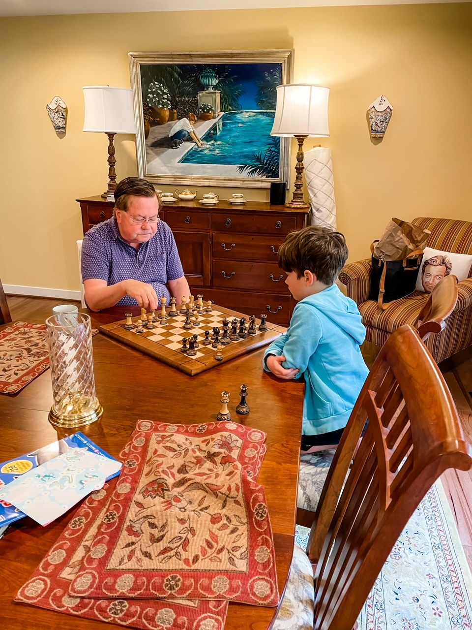 Grandfather and grandson playing chess