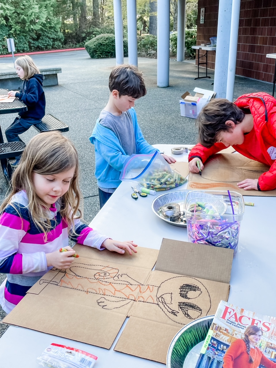 Marie's grandkids decorating their cardboard as part of their Unplugged Activities for Kids