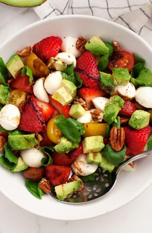 A bowl of the strawberry salad with balsamic