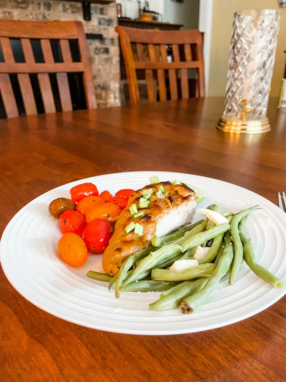 A plate of the 5 Ingredient Peanut Chicken with blistered tomatoes and green beans