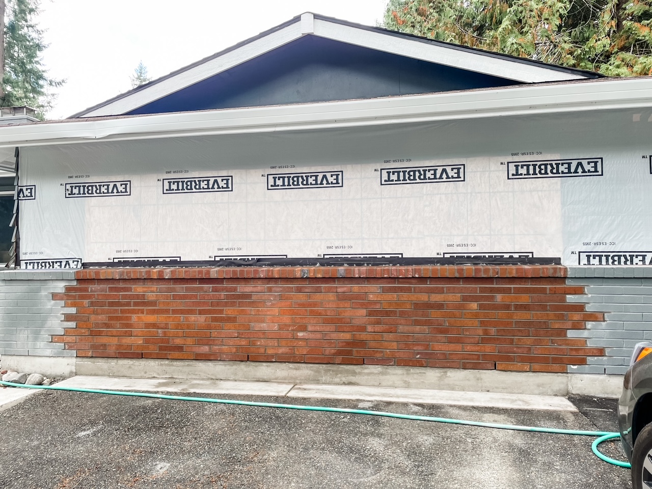 The brick wall constructed in place of the garage door