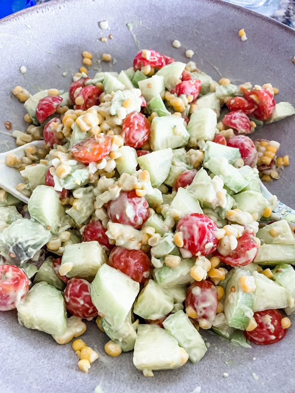 The finished and dressed Cucumber, Corn and Tomato Salad with Easy Avocado Dressing