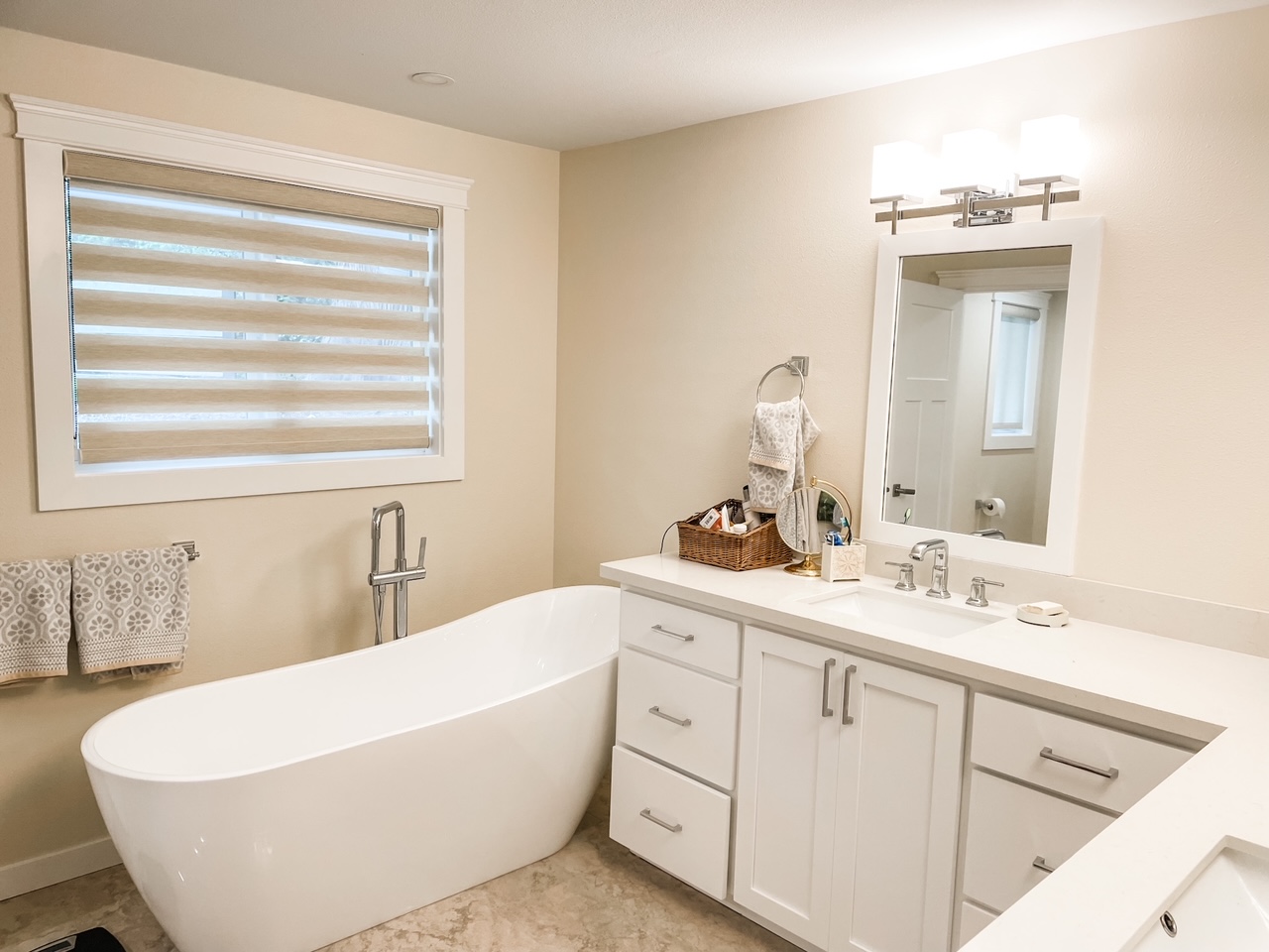 The new soaking tub alongside the vanities