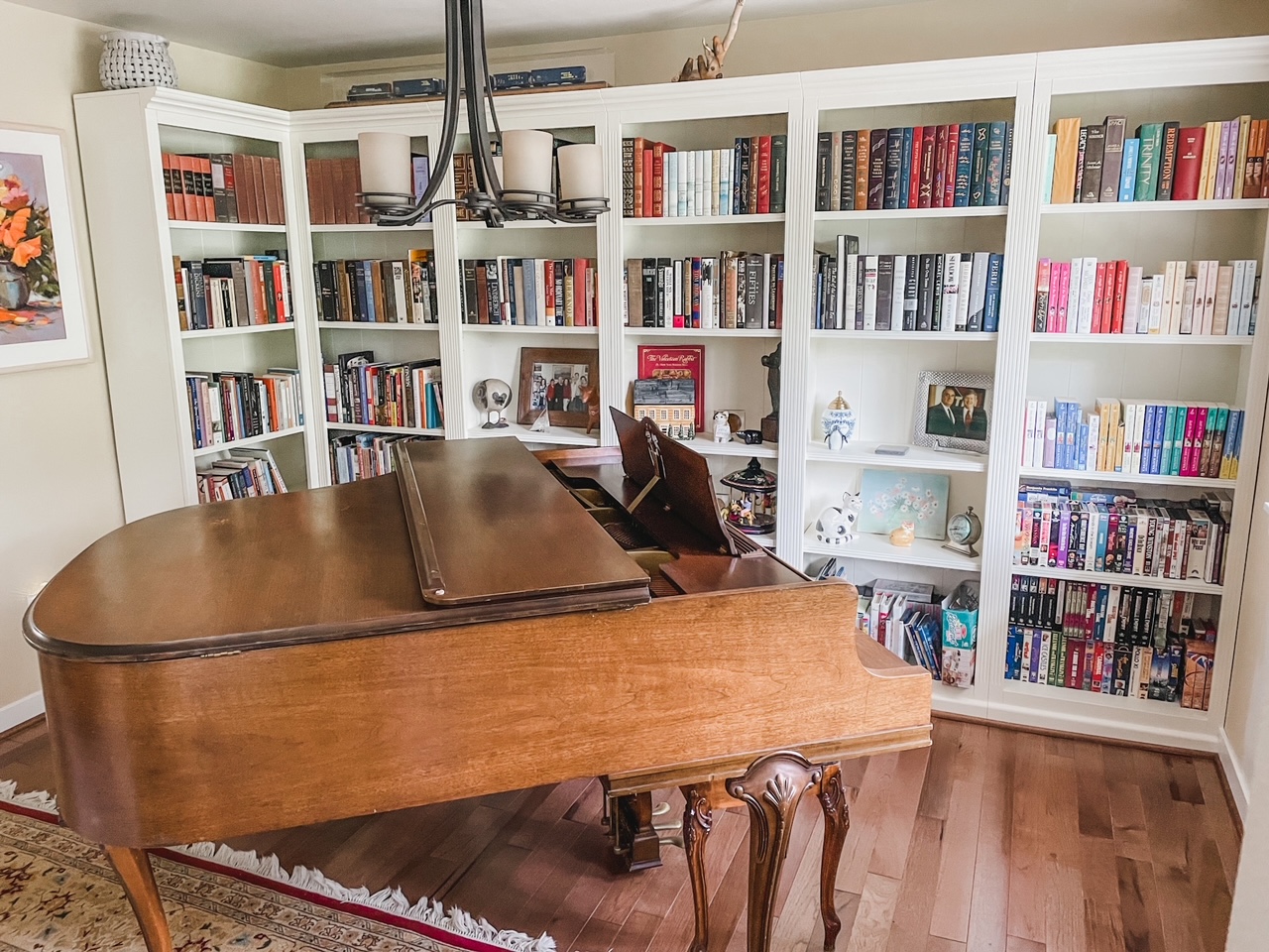 Marie's dining room transformed into a unique book storage solution - a piano and library room. 