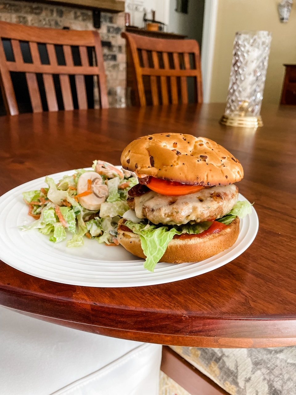 The finished Best Grilled Turkey Burgers on a plate with a side salad