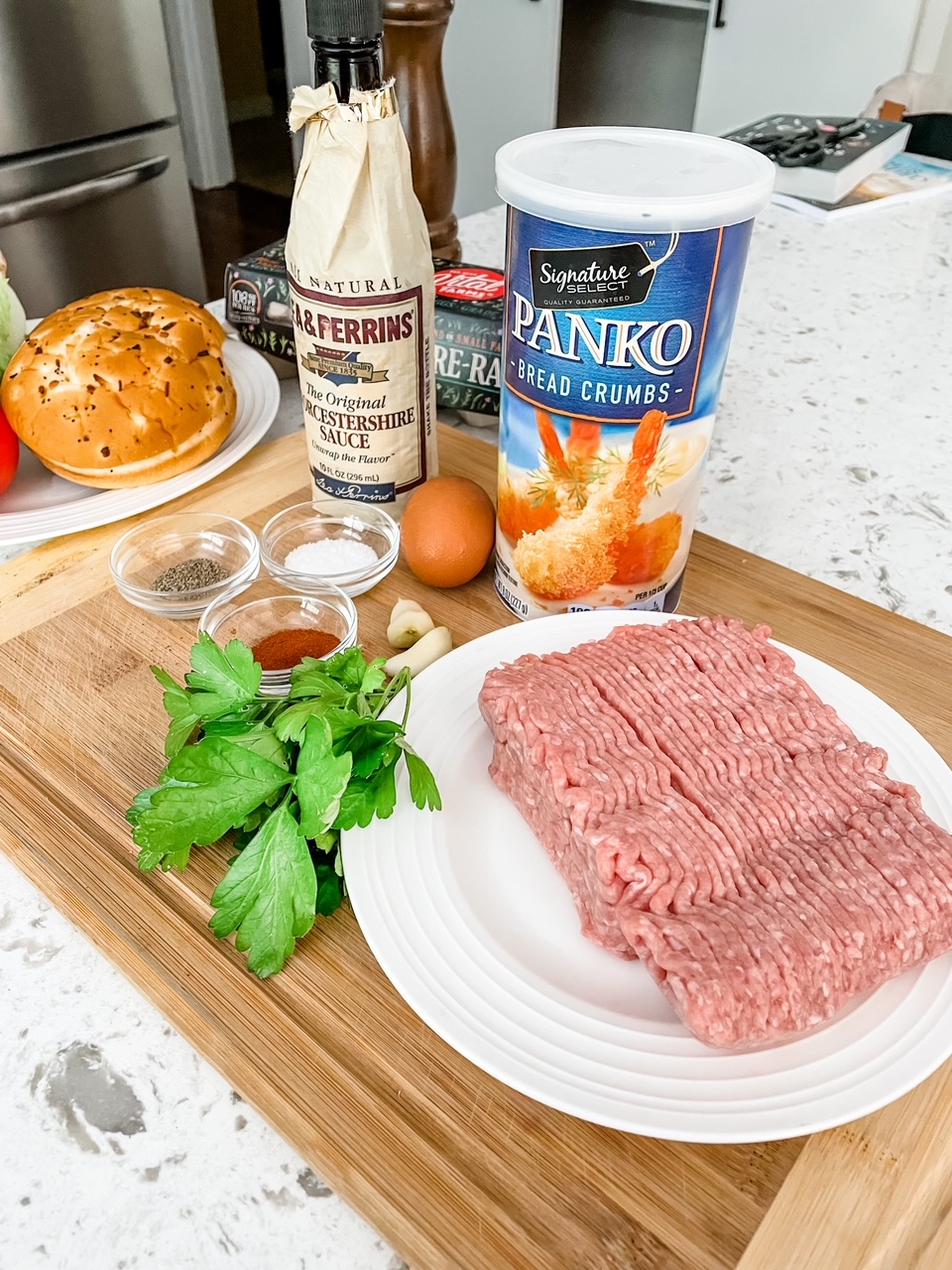 The spices, flavorings, and raw turkey meat laid out on a counter