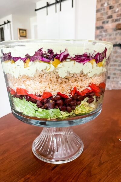 The Vegetarian Layered Salad with Avocado and Lime Dressing served in a trifle dish