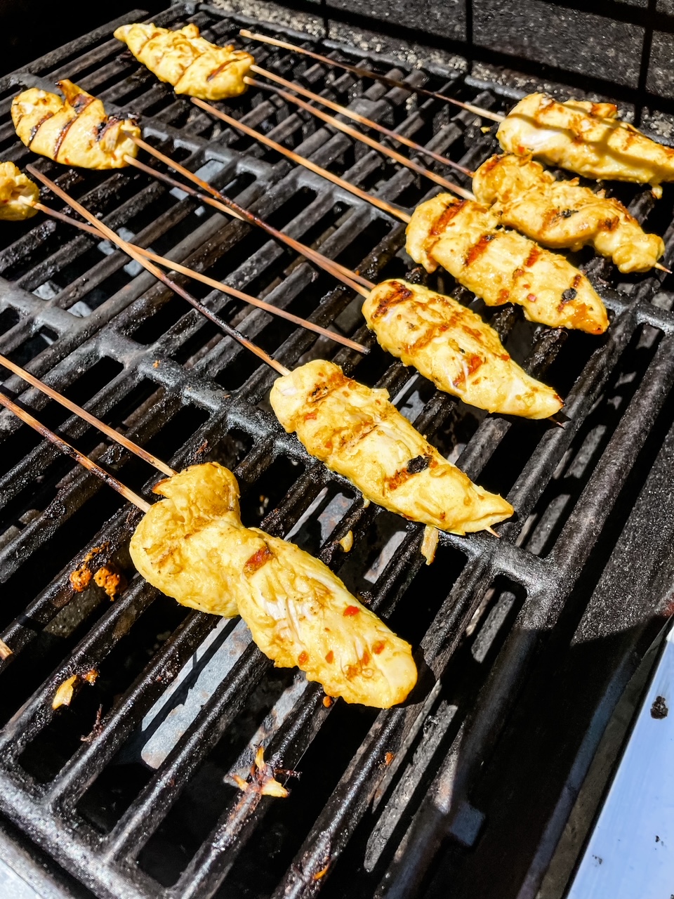The skewers being grilled 