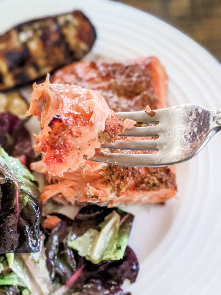 The cedar plank smoked salmon served with a salad
