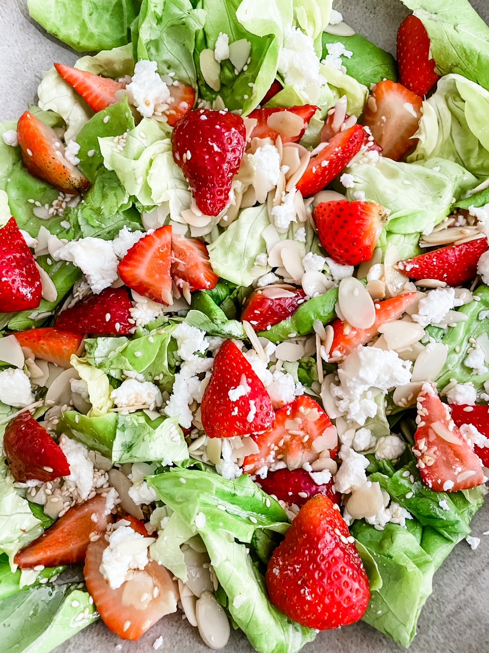 A close up of the Strawberry and Chevre Salad with Sesame Vinaigrette