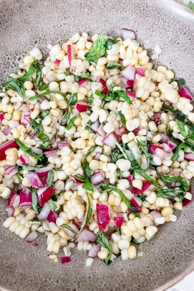The finished Barefoot Contessa’s BEST Corn and Basil Salad served in a bowl