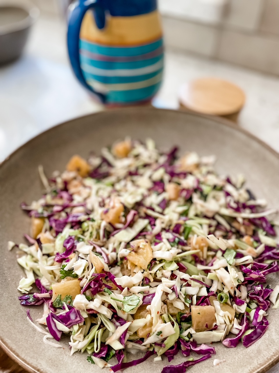 The Spicy Pineapple Coleslaw in a serving bowl