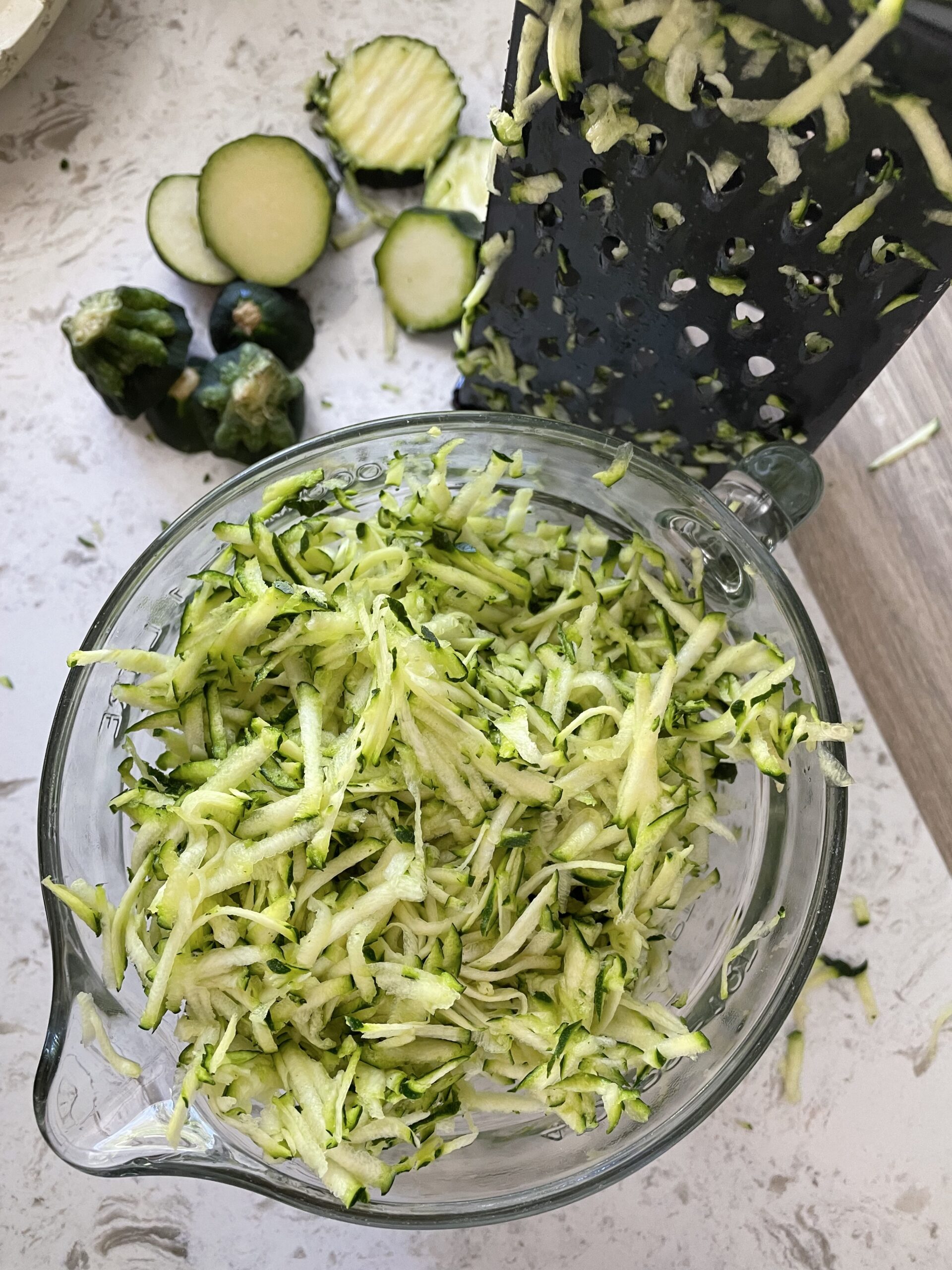 Shredding the raw zucchini in a food processor