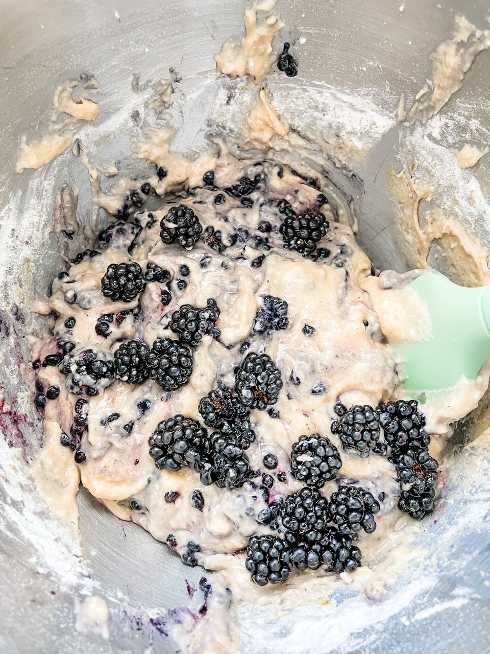 The blackberries being folded into the batter for the Easy Blackberry Coffee Cake Recipe 