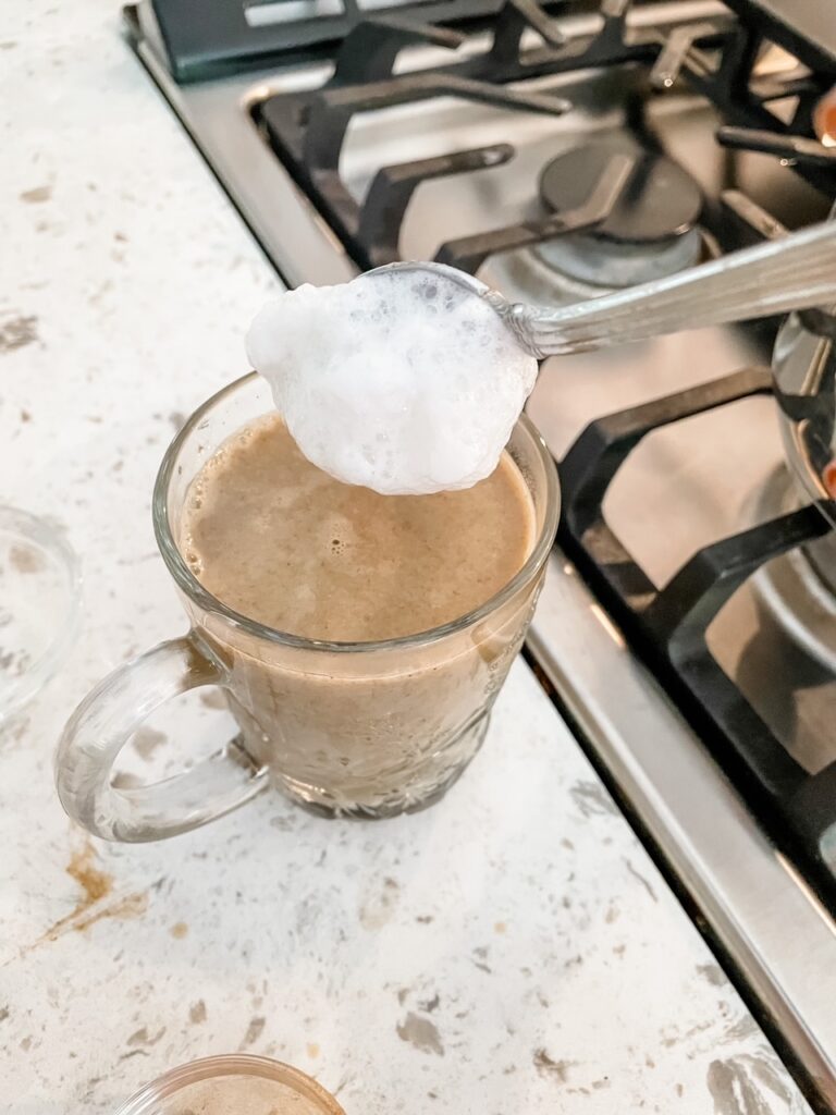Topping the coffee base with foam 