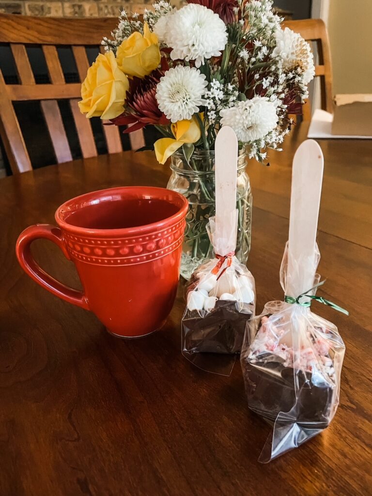 The DIY Cocoa Spoons next to a mug