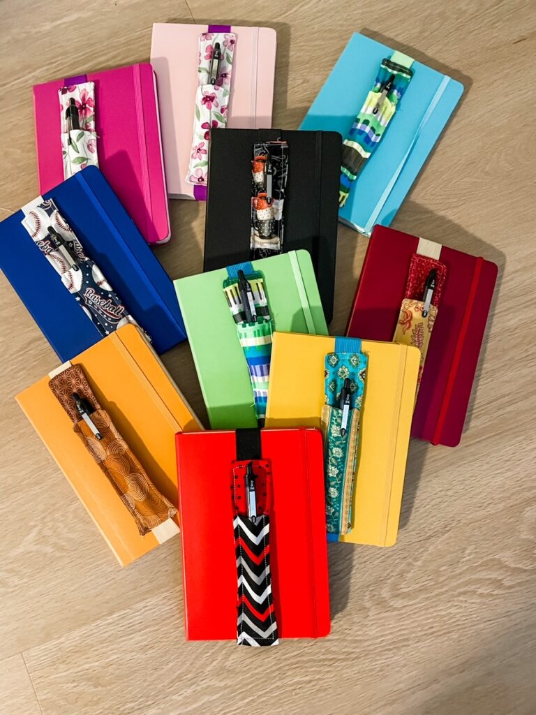 A colorful array of the finished DIY Pen Pouches with their notebooks