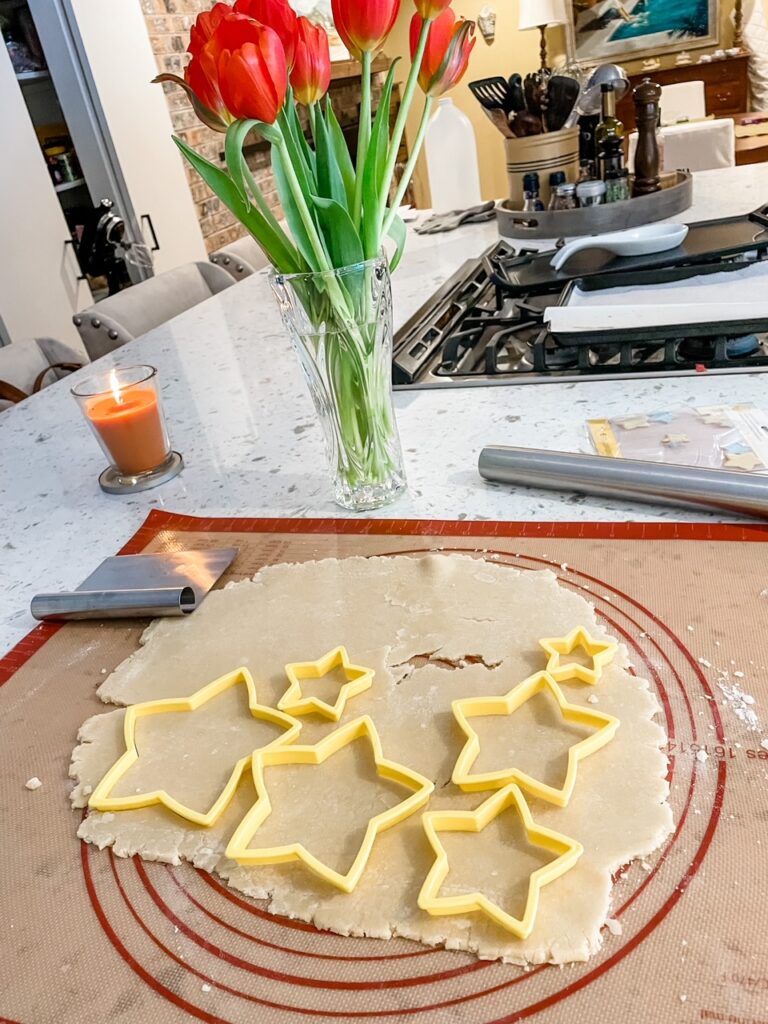 Rolled out dough with the cutters placed to maximize the amount of stars
