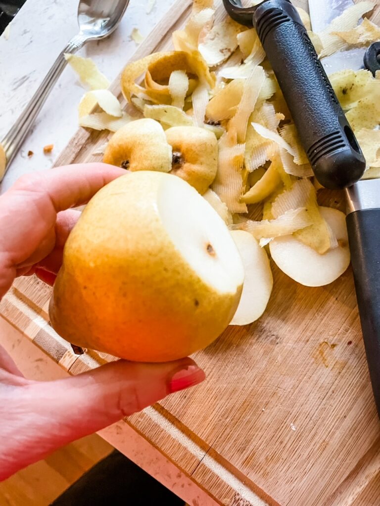 A pear with the bottom portion sliced off