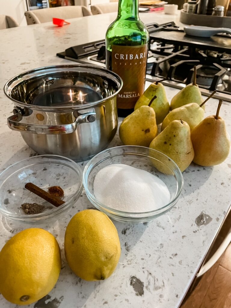 The ingredients for the Poached Pears with Marsala laid out on a counter