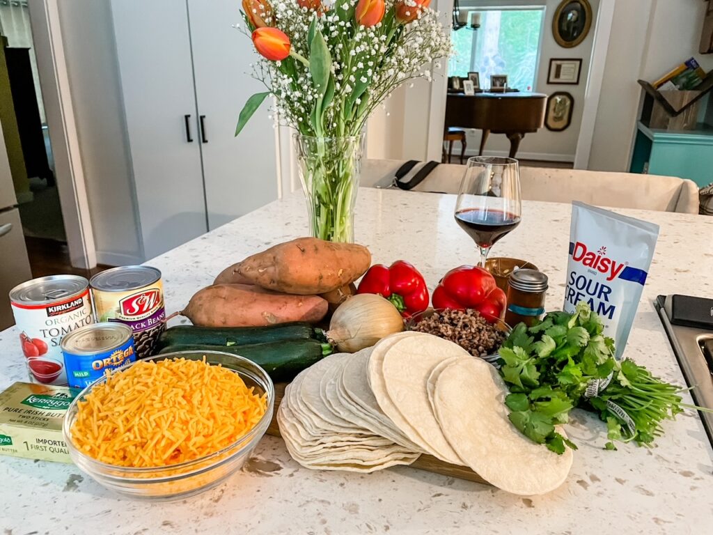 The ingredients for the Sweet Potato and Roasted Vegetable Enchiladas spread out on a countertop