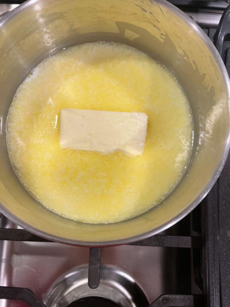 Butter and milk combining in a pan