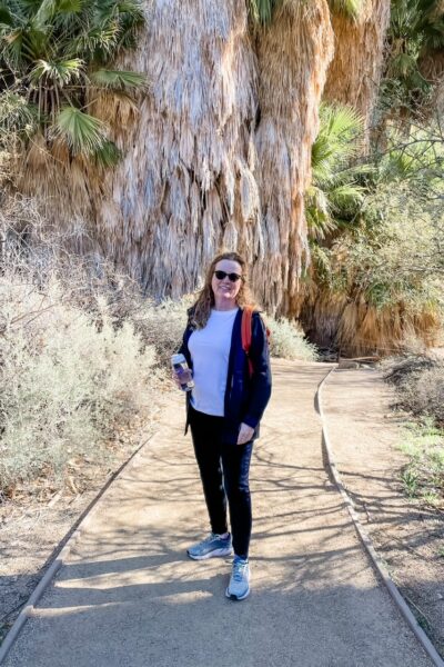 Marie hiking in Joshua Tree, one of the parks in the Palm Springs / Coachella Valley area