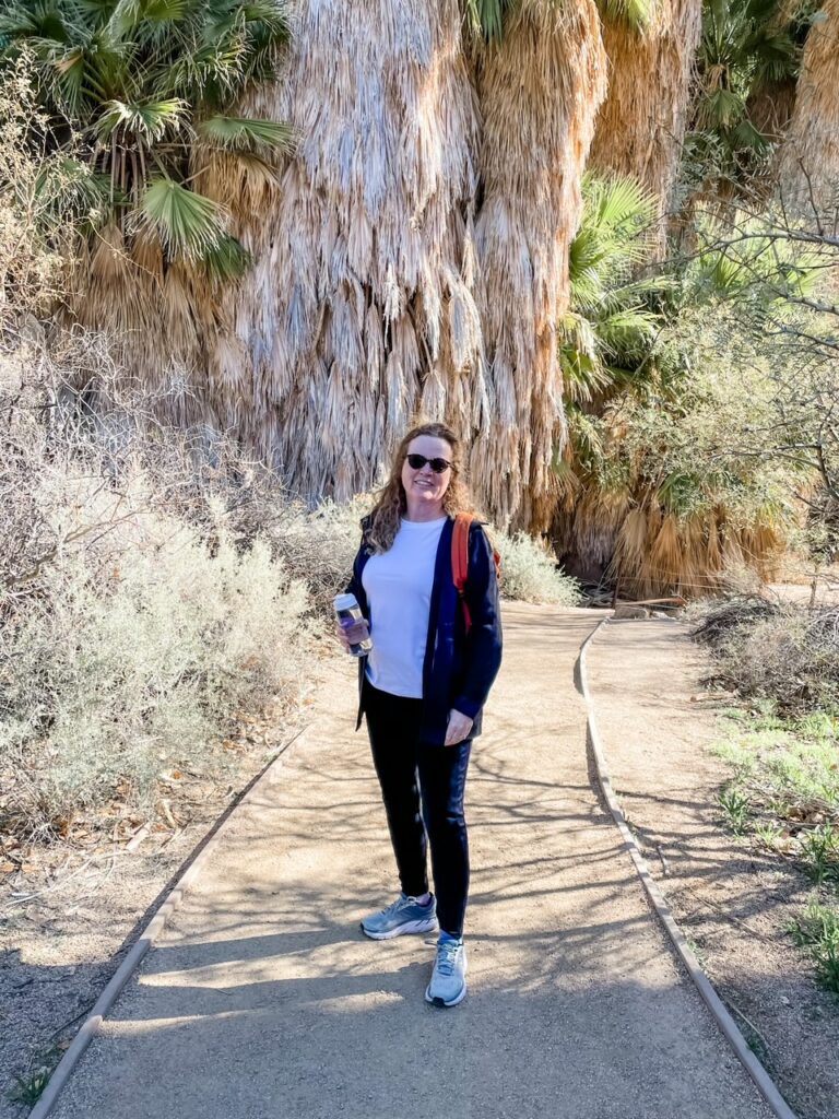 Marie hiking in Joshua Tree, one of the parks in the Palm Springs / Coachella Valley area