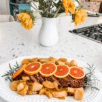 The finished Citrus Slow Cooker Ham placed on a serving platter