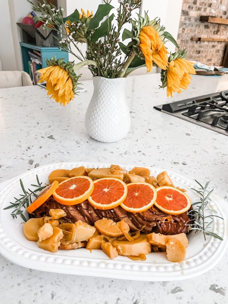 The finished Citrus Slow Cooker Ham placed on a serving platter