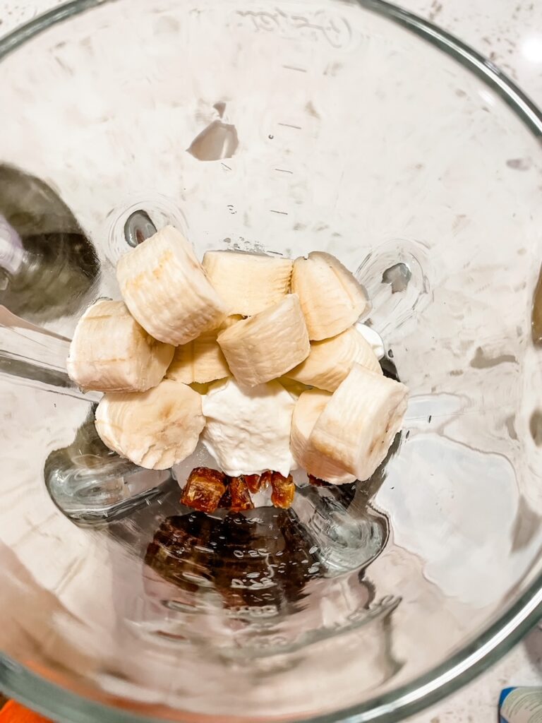 The more solid ingredients for the smoothie placed at the top of the blender