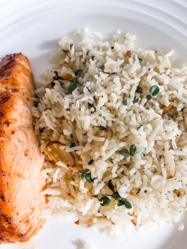 The finished Lemon Herb Rice Pilaf alongside some fish