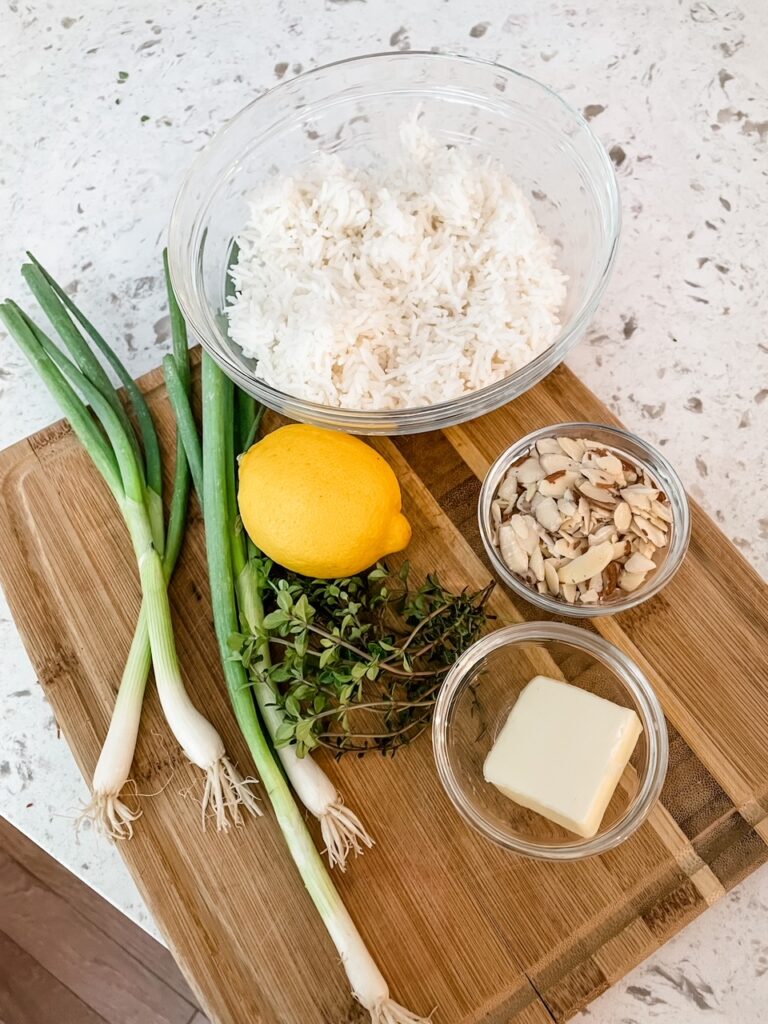 The listed ingredients for the Lemon Herb Rice Pilaf on a cutting board