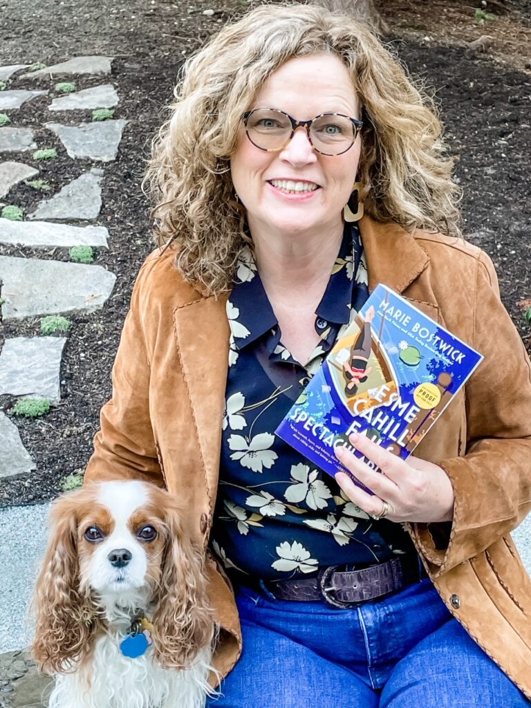 Marie posing with a copy of Esme Cahill