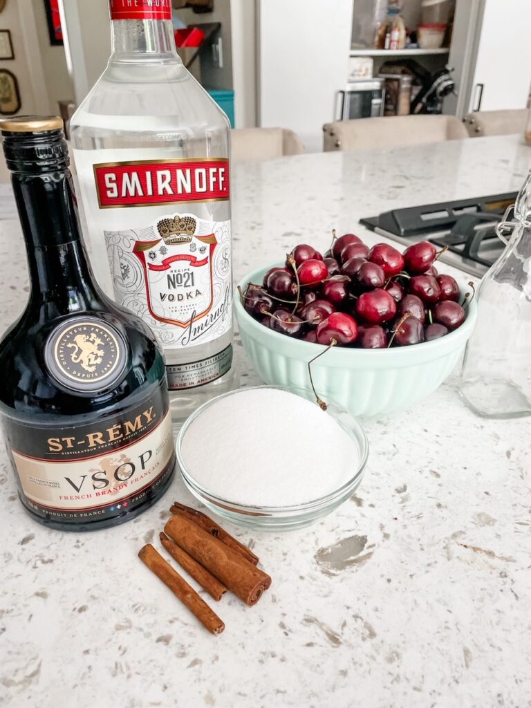 Ingredients for how to Make Your Own Cherry Liqueur on a counter