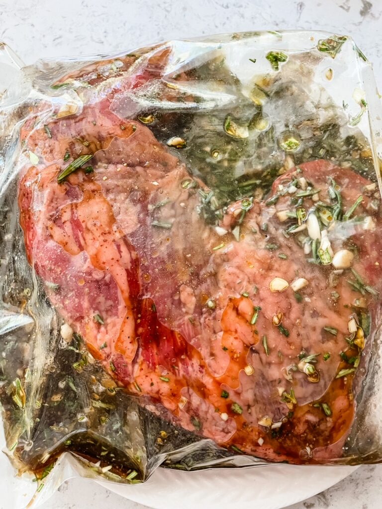 The trip tip marinating in a bag 
