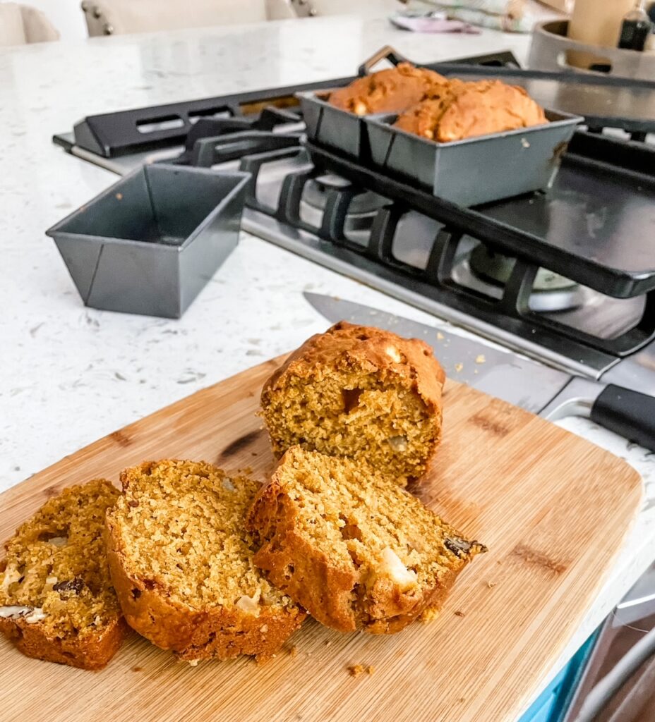 Slices of the Fall Pumpkin Apple Bread on a cutting board